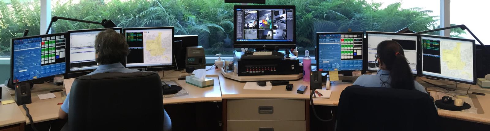 Dispatchers sitting at work stations